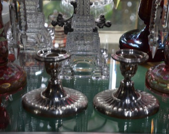 A Pair of Art Deco EPNS Candle Holders