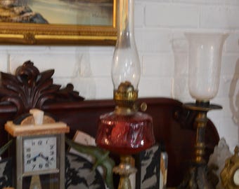 An Elegant Victorian Brass and Cranberry Glass Duplex Oil Lamp
