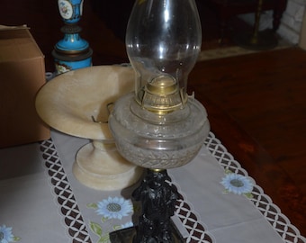 An Antique Bronze Based Child Figure Oil Lamp