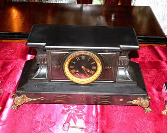 A 19th Century French Slate Clock and Garnitures