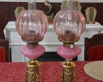 A Magnificent Pair of Pink Glass Hinks No.2 Duplex Oil Lamps