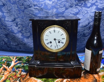 An Antique Cast Iron Black Enameled French Clock