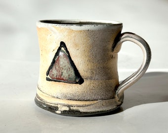 Soda fired mug with triangle decoration