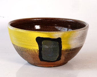 Soda fired yellow and white bowl with shape decoration