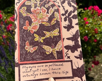May include: A vintage-style illustration of a rose and moths with the text "My eyes are so polloned and yet I see, I have always known this life."