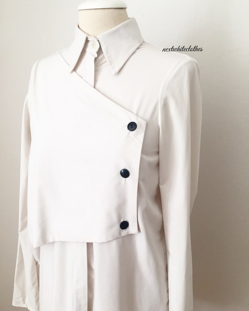 collared shirt minimal button up top long sleeves cream white button down tunic with collar neckline double layer blouse with buttons