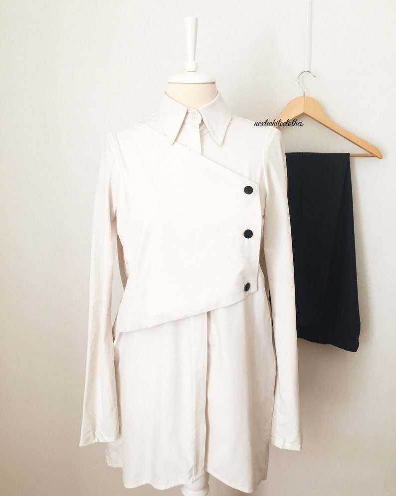 collared shirt minimal button up top long sleeves cream white button down tunic with collar neckline double layer blouse with buttons