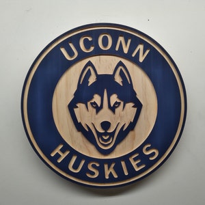 UCONN HUSKIES 11" round carved and hybrid painted/natural grain wall hanging sign