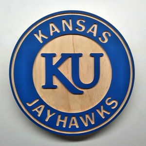 Kansas Jayhawks KU carved wood wall hanging sign (11 inches round hybrid painted/natural wood grain)