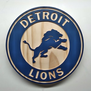 Detroit Lions 11&quot; round painted/natural grain wood wall hanging sign
