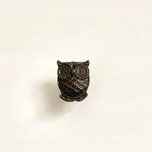 May include: Two white drawers with black owl-shaped drawer pulls.