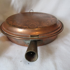 Vintage koperen bedwarmer: gegraveerd bloemendecor