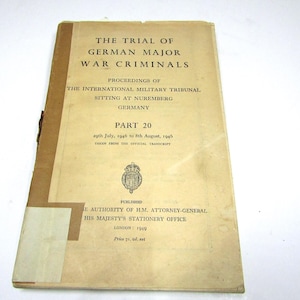 May include: A vintage softcover book titled The Trial of German Major War Criminals, Part 20, covering proceedings from July 29, 1946, to August 8, 1946. The beige cover features black text, a royal crest, and a brown vertical spine strip.