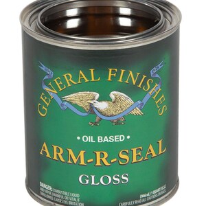 May include: A green can of General Finishes Arm-R-Seal Gloss oil-based wood finish. The can has a red, white, and blue eagle logo with the words "Since 1928" on the label. The can is 1 quart (946 ml).