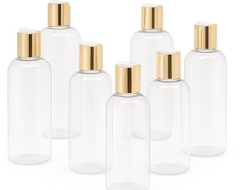 New 4/6/oz Clear PET Skincare Bottle with Metalized Gold Disc Cap.