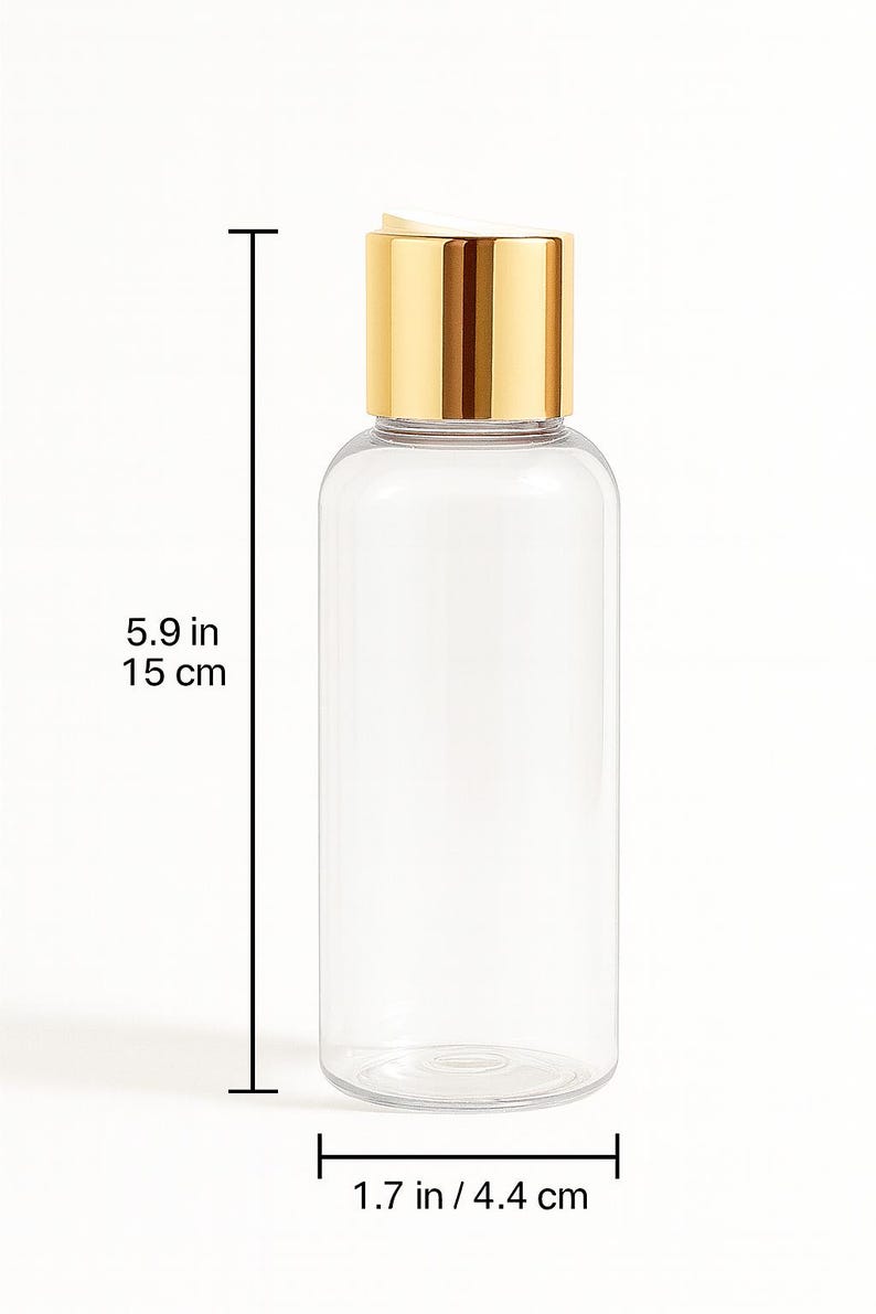 K&ouml;nnte beinhalten: Transparente, zylindrische Flasche mit goldfarbenem Deckel. Die Flasche ist 15 cm hoch und 4,4 cm breit. Der Deckel hat eine gl&auml;nzende Goldfarbe. Die Flasche ist leer und transparent, geeignet f&uuml;r verschiedene Fl&uuml;ssigkeiten.