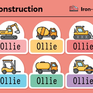 May include: Six iron-on patches featuring yellow construction vehicles with the word "Ollie" on each patch. The vehicles include an excavator, cement mixer, bulldozer, forklift, fuel tanker, and a road roller.