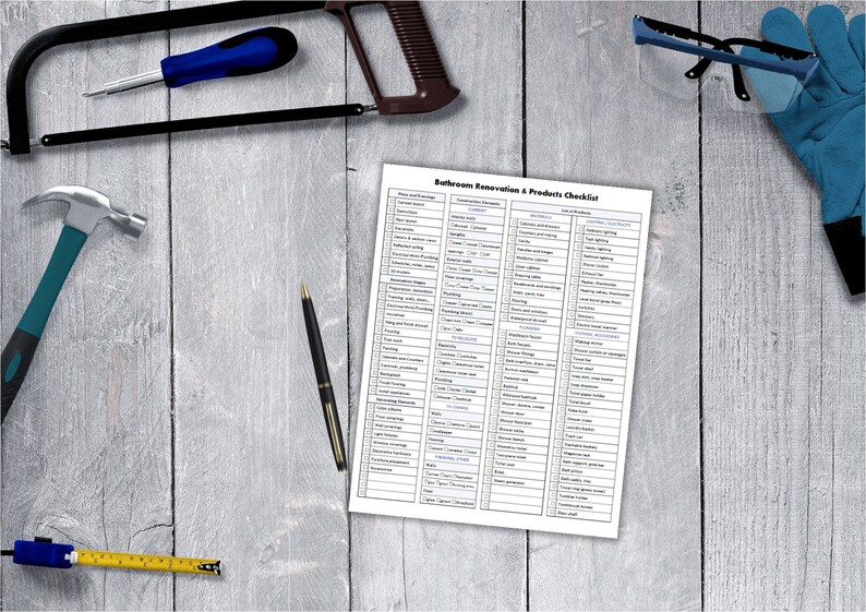 May include: A checklist for bathroom renovation projects, with categories for plumbing, fixtures, lighting, and more. The checklist is printed on white paper and is surrounded by tools, including a hammer, a saw, a tape measure, a pen, safety glasses, and work gloves.