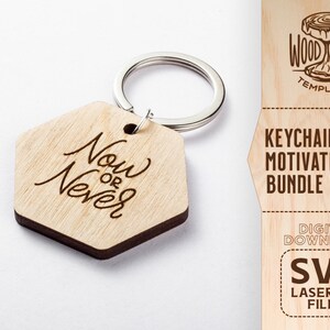 May include: Wooden keychain with a hexagonal shape and a silver key ring. The keychain has the words "Now or Never" engraved on it. The keychain is part of a motivational keychain bundle.