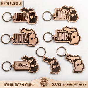 Peut inclure: Porte-clés en bois en forme de l'État du Michigan. Certains porte-clés indiquent "Michigan" ou "Made in Michigan" avec un cœur. D'autres disent "home". Les porte-clés ont un contour marron foncé et un intérieur marron clair. Le texte "DIGITAL FILES ONLY!" est en haut.