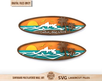 May include: Multi-layered wooden surfboard wall art with a sunset, ocean waves, palm trees, and the text "Catch the wave".