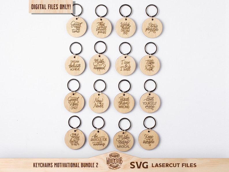 May include: A set of 16 laser cut wooden keychains with motivational quotes. The keychains are round and feature a variety of inspirational messages, such as "Good Vibes Only", "Dream Believe Achieve", and "Make Today Magical".