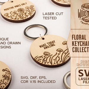 Pu&ograve; includere: Una collezione di portachiavi in legno tagliati al laser con motivi floreali e citazioni ispiratrici. I portachiavi sono di vari colori e presentano diversi motivi floreali. Il testo sui portachiavi include "Positive Vibes Only", "Make Today Amazing" e "Worthy".