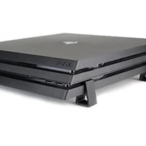 May include: A black PlayStation 4 console with a stand. The console is stacked on top of another console. The stand is made of black plastic and has a triangular shape.