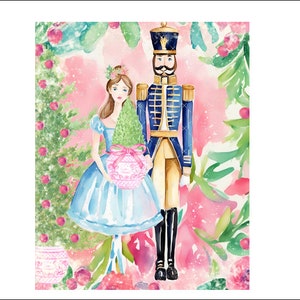 May include: A watercolor painting of a nutcracker soldier and a ballerina holding a small Christmas tree. The background is a pink and green watercolor wash with white snowflakes.