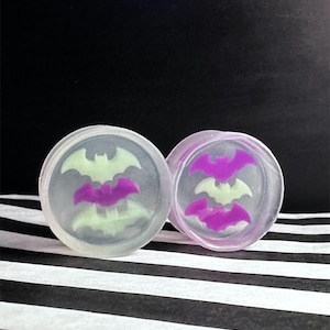 Squishy alternative bat plugs, tiny bats set in custom clear silicone gauges for emo pastel goth,  colourful earrings for stretched ears.