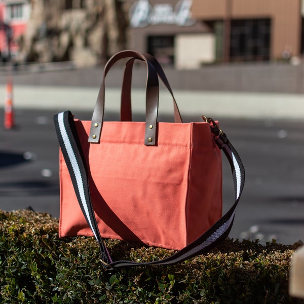 Tag&Crew Brooklyn Tote Canvas Bag with Leather Handles, Zippered Flap, 3 Pockets, Adjustable Shoulder Strap, Antique Brass Clips