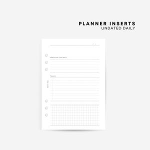 May include: A white daily planner insert page with black text and lines. The top features the text PLANNER INSERTS UNDATED DAILY. The layout includes sections for a date, Verse of the Day, Tasks, and a grid section at the bottom with six ring holes.