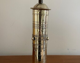 Vintage cylindrical brass coffee grinder