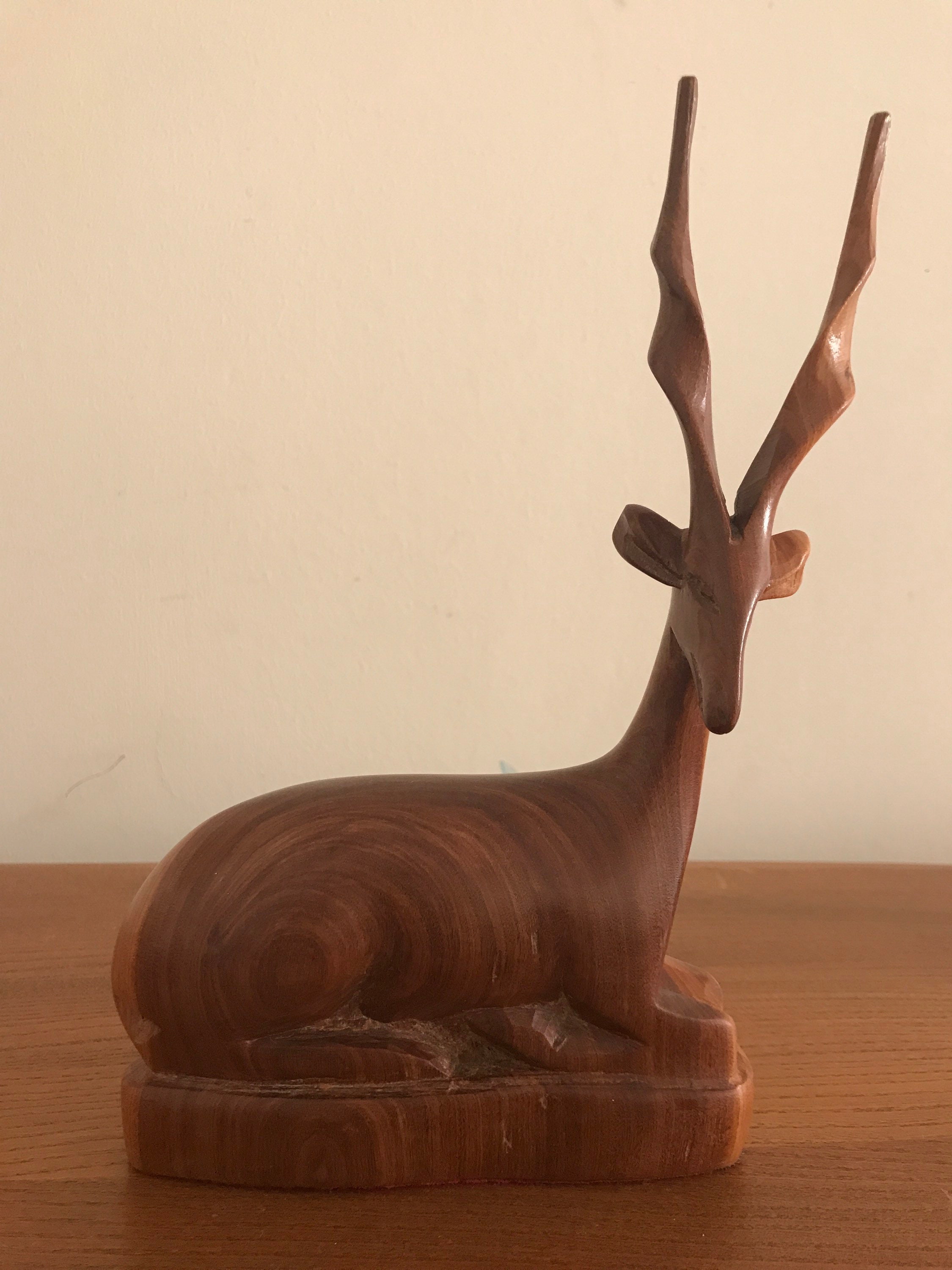 Vintage carved wood sitting antelope figure