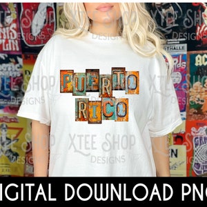 May include: White t-shirt with a graphic of the words "PUERTO RICO" in colorful, distressed, vintage-style letters.