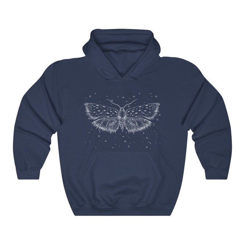 May include: A navy blue hoodie with a white outline of a moth with wings spread wide. The moth is surrounded by small white dots, resembling stars.