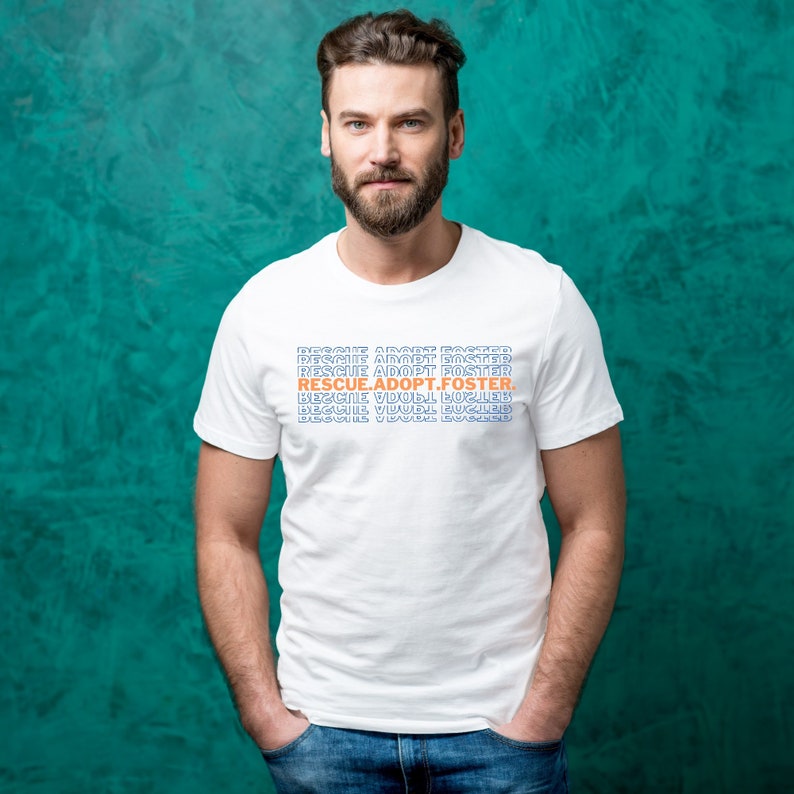 May include: White t-shirt with the text "RESCUE.ADOPT.FOSTER." printed in blue and orange letters.