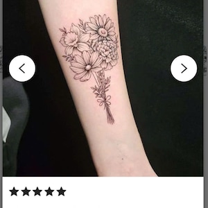 May include: A black and white line drawing tattoo of a bouquet of flowers on a person's arm. The flowers include a daisy, a daffodil, and a carnation.