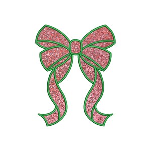 May include: A pink glitter bow with green outlines. The bow is tied with two long tails.