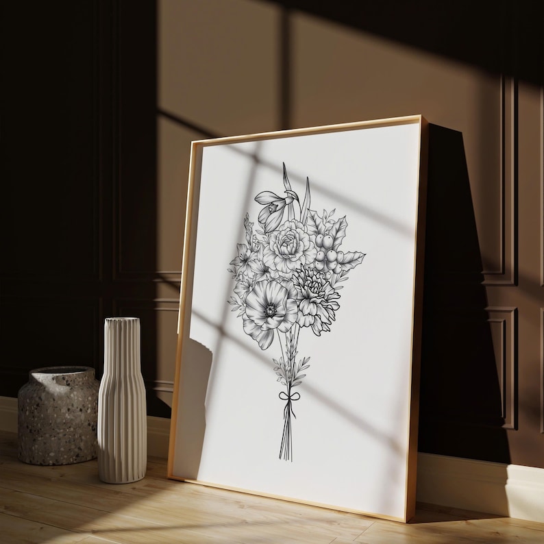 May include: A black and white line drawing of a bouquet of flowers in a wooden frame. The flowers include a poppy, a rose, and a snowdrop.