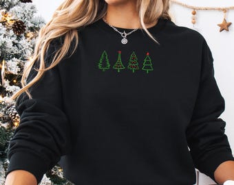 May include: Black sweatshirt featuring four embroidered Christmas trees in green, with red star accents on two. The trees are arranged horizontally across the chest. The sweatshirt is a casual, festive garment.