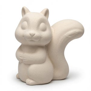 May include: A cream-coloured ceramic squirrel figurine with a matte, unglazed finish. The squirrel is depicted in a seated position with its front paws held together near its chest and a large, bushy tail curving upwards behind its body.