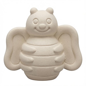 May include: A cream-colored, unpainted ceramic figurine shaped like a bee with a rounded head, a smiling face, two small antennae, and large, stylized wings extending from its segmented body. The surface has a matte, slightly textured finish.