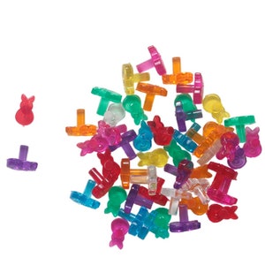 May include: A large pile of colorful plastic Easter bunny and flower shaped light bulb holders.