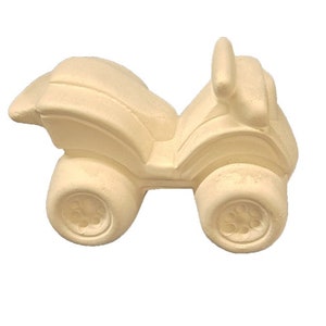 May include: A white ceramic ATV toy with a rounded design. The toy has a seat, handlebars, and four wheels.