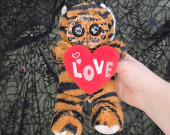 茶色のクモトラ粘土顔のテディベアぬいぐるみ