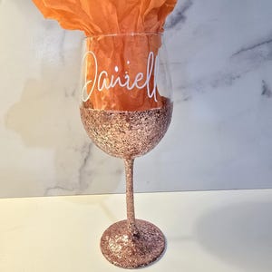 Rose gold glitter with fancy font. White vinyl.