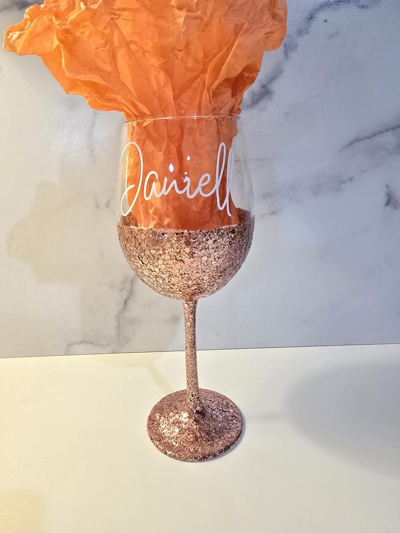 Rose gold glitter with fancy font. White vinyl.