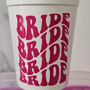 Solid white 16 oz stadium cup with hot pink vinyl. Bride cup for bachelorette parties.