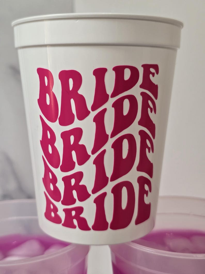 Solid white 16 oz stadium cup with hot pink vinyl. Bride cup for bachelorette parties.
